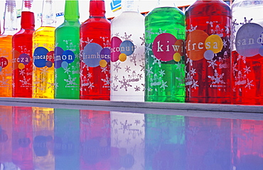 Different colored bottles of flavoured drink syrup, Playa del Carmen, Mexico, North America