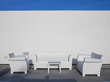 White chairs against a white wall and blue sky, Mayan Riviera, Akumal, Yucatan, Quintana Roo, Mexico, North America