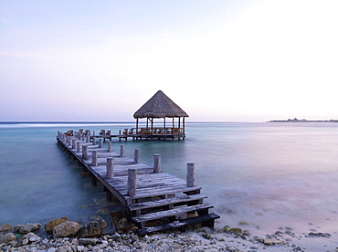 Pier with palapa jutting out into the water from the beach, Mayan Riviera, Akumal, Yucatan, Quintana Roo, Mexico, North America