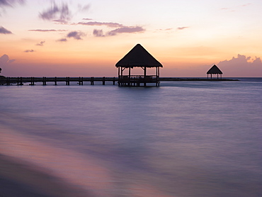 Pier with palapa jutting out into the water from the beach at sunrise, Mayan Riviera, Akumal, Yucatan, Quintana Roo, Mexico, North America