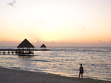 Person watching sunrise from the beach at sunrise, Mayan Riviera, Akumal, Yucatan, Quintana Roo, Mexico, North America