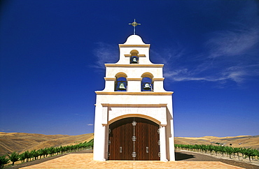 Spanish Mission style church on hill with grape vineyard, Paso Robles, California, United States of America, North America