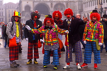 Clowns in the Piazza San Marco at Carnevale (Carnival), Venice, Veneto, Italy, Europe