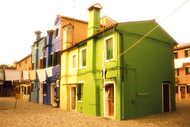 Colorful homes with laundry hanging outside, Island of Burano, Venice, Veneto, Italy, Europe