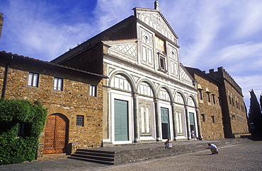 Church of San Miniato al Monte, with person taking photo of friend on the steps, Florence, Tuscany, Italy, Europe