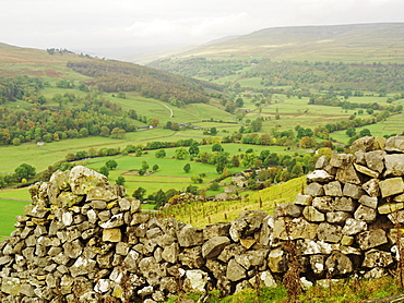 Scenic view of valley and deteriorated dry stone wall, Yorkshire Dales National Park, Yorkshire, England, United Kingdom, Europe