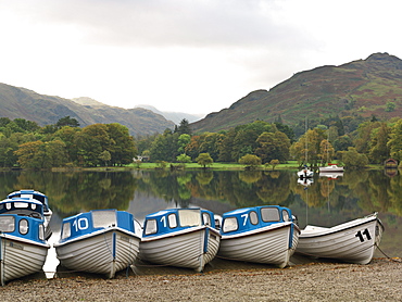 Boats moored at dock for rent on Ullswater, Glenridding, Ullswater, Lake District National Park, Cumbria, England, United Kingdom, Europe