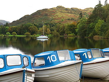 Boats moored at dock for rent on Ullswater, Glenridding, Ullswater, Lake District National Park, Cumbria, England, United Kingdom, Europe