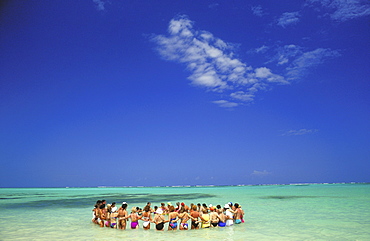 Group of people forming a circle in the Caribbean Sea, Bavaro Beach, Punta Cana, Dominican Republic, West Indies, Caribbean, Central America