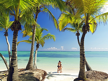 Couple walking on white sandy beach, Bavaro Beach, Punta Cana, Dominican Republic, West Indies, Caribbean, Central America