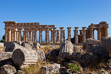 Temple of Athena ruins and Temple of Hera in the background at Selinunte, the ancient Greek city on the southern coast of Sicily, Italy, Europe