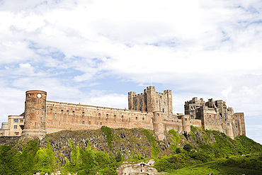 Bamburgh Castle, a hilltop fortress and Grade I Listed Building, Bamburgh, Northumberland, England, United Kingdom, Europe