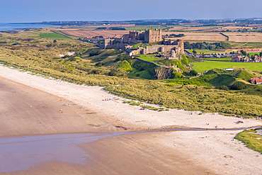 Aerial view by drone of Bamburgh Castle. Bamburgh, Northumberland, England, United Kingdom, Europe