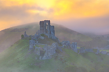 Corfe Castle at sunrise, Dorset, England, United Kingdom, Europe