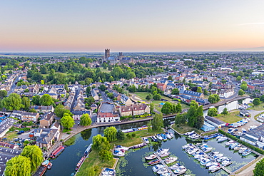 Drone view of Ely Cathedral with Ely Marina and Great Ouse River in foreground, Ely, Cambridgeshire, England, United Kingdom, Europe