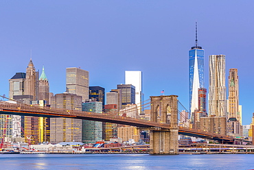 Manhattan skyline and Brooklyn Bridge across East River, New York, United States of America, North America