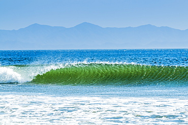 Classic curling shore break surf wave, typical of this coast, Playa Hermosa, San Juan del Sur, Rivas Province, Nicaragua, Central America