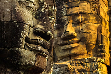 T wo of 216 smiling sandstone faces at 12th century Bayon, King Jayavarman VII's last temple in Angkor Thom, Angkor, UNESCO World Heritage Site, Siem Reap, Cambodia, Indochina, Southeast Asia, Asia