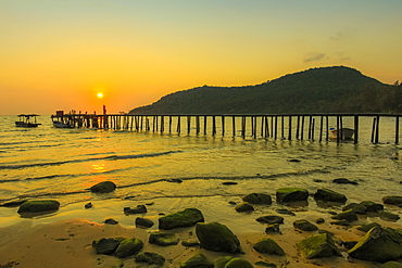 Sunset and pier on the quiet rocky west coast of this holiday island, Lazy Beach, Koh Rong Sanloem Island, Sihanoukville, Cambodia, Indochina, Southeast Asia, Asia