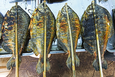 Fish barbecued with sticks at a stall in the Crab Market in this resort town famous for its seafood, Kep, Cambodia, Indochina, Southeast Asia, Asia