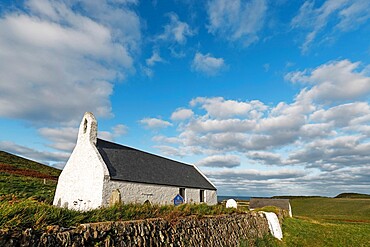 The 13th century Church of the Holy Cross, a Grade 1 listed parish church near popular Mwnt beach, Mwnt, Ceredigion, Wales, United Kingdom, Europe