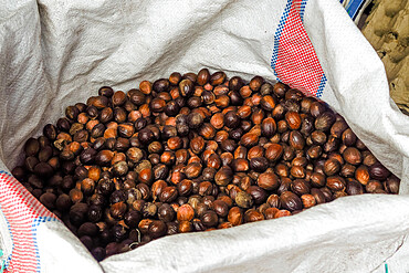 Nutmeg in sack at the market, an aromatic spice & major crop here. Ulu, Siau Island, Sangihe Archipelago, N Sulawesi, Indonesia