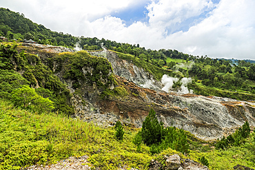 Steaming fumarole field at Bukit Kasih, a tourist volcanic park with a world peace themed tower and worship houses of five major religions, Bukit Kasih, Minahasa, North Sulawesi, Indonesia, Southeast Asia, Asia