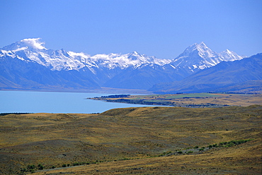 Looking north along Lake Pukaki towards the Southern Alps, with Mt Sefton, left, and Mt Cook, right; (glacial sediment causes the blue of many NZ lakes), Canterbury, South Island, New Zealand