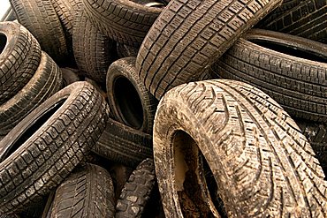 Old motor-car tires on a garbage depot