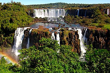 Cascades with rainbow Iguazu Waterfalls Argentina Brazil