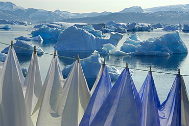 Clothesline with laundry in front of icebergs in Sermilik Fjord Tiniteqilaaq Eastgreenland