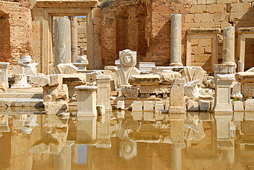 Head of a medusa and other wreckage mirror in water new forum Leptis Magna Libya