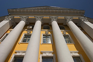 Ukraine Kiev district Podil Kontraktova Place oldest place of town view to the historical building of Mohyla Akademie with its columns in front of the building blue sky 2004