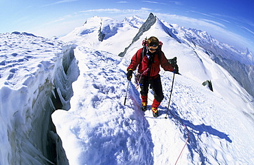 Woman near a crevasse on Allalinhorn Valais Switzerland