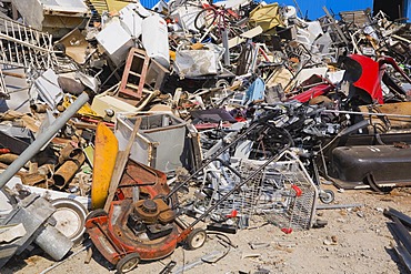 Pile of discarded household and industrial items at a scrap metal recycling centre, Quebec, Canada