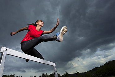 Athlete, 20 years, jumping hurdles, Winterbach, Baden-WâˆšÂºrttemberg, Germany