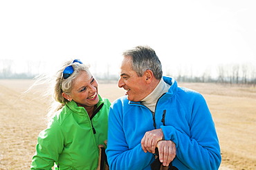 Smiling senior couple on a meadow