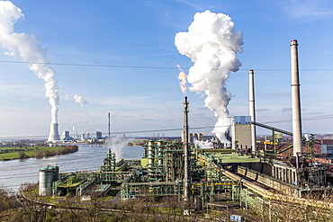 Coking plant, steel plant by the Rhine, furnaces Schwelgern 1 and 2, cooling tower of coal power plant Duisburg Walsum behind, ThyssenKrupp Steel Europe, Hamborn, Duisburg, North Rhine-Westphalia, Germany, Europe