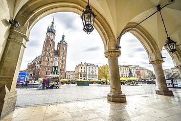 Cloth Hall and St. Mary's Basilica on main Market Square in Krakow, Poland, Europe