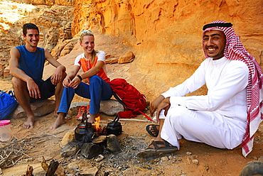 Tourists drink Tea with Bedouin in Wadi Rum, Jordan, Asia