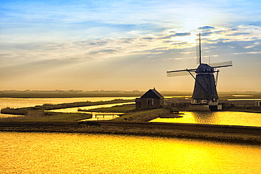 Historic water mill in evening twilight, Texel, North Holland, Netherlands