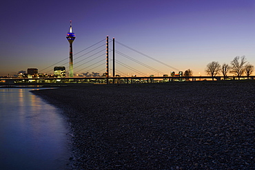 City gate, Rhine Tower and Rheinknie Bridge in the evening light, Rhine riverbank, Düsseldorf, North Rhine-Westphalia, Germany, Europe