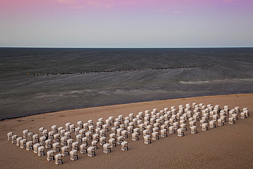 White beach chairs on the beach at twilight, Baltic Seaside Resort Sellin, Rügen, Mecklenburg-Western Pomerania, Germany, Europe