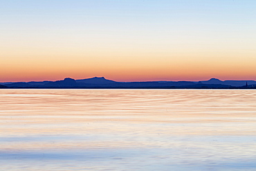 Sunset behind Hegau Volcano Hohenstoffeln, Hohentwiel, Hohenhewen, Hohenkrahen, Magdeberg and Radolfzell, Reichenau Island, Reichenau, Baden-Wurttemberg, Germany, Europe