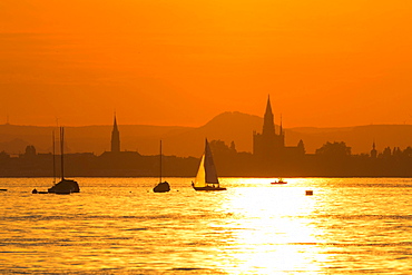 Skyline at sunset with sailboat, Lake Constance, Konstanz, Baden-Württemberg, Germany, Europe