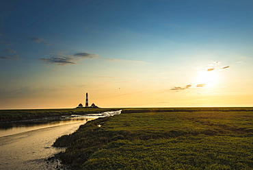 Creek in the saltmarshes in front of Westerhever Lighthouse in the evening sun, Westerhever, Eiderstedt, North Frisia, Schleswig-Holstein, Germany, Europe