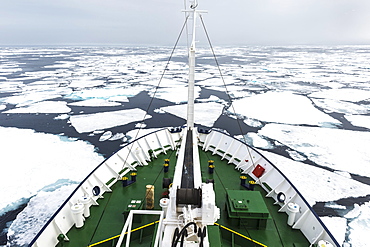 Expedition Boat navigating through melting pack ice, Arctic Ocean, 81° North and 26° East, Svalbard Archipelago, Norway, Europe