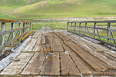 Old wooden bridge over a Mountain river, Naryn gorge, Naryn Region, Kyrgyzstan, Asia