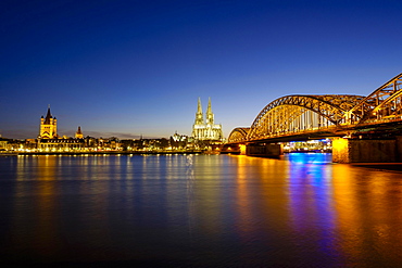 Church St Martins and Cologne Cathedral with Hohenzollern Bridge over the Rhine, Dusk, Cologne, North Rhine-Westphalia, Germany, Europe