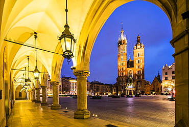 Illuminated market square at dawn, Krakow, Poland, Europe